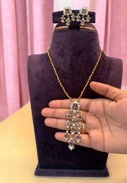 Simple party wear set with purple colour stones